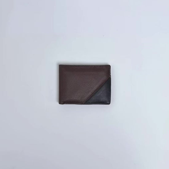 Karla Hanson Men's RFID Martin Bifold Wallet Leather with removable card insert product video. Person places cash, cards, and change inside compartments in wallet.